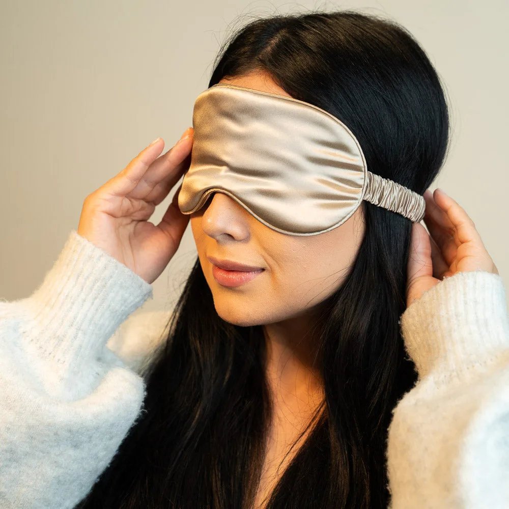Lifestyle image of a private label contoured silk sleep mask suited for beauty, spa, travel, hotel amenity, and wellness gift programs