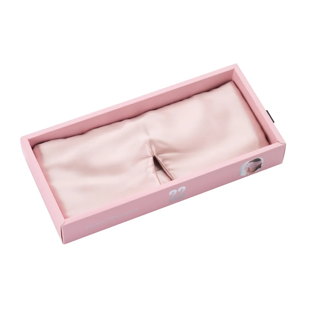 Detail view of pink private label silk sleep mask displayed in a gift box for branded spa, beauty, and travel retail programs