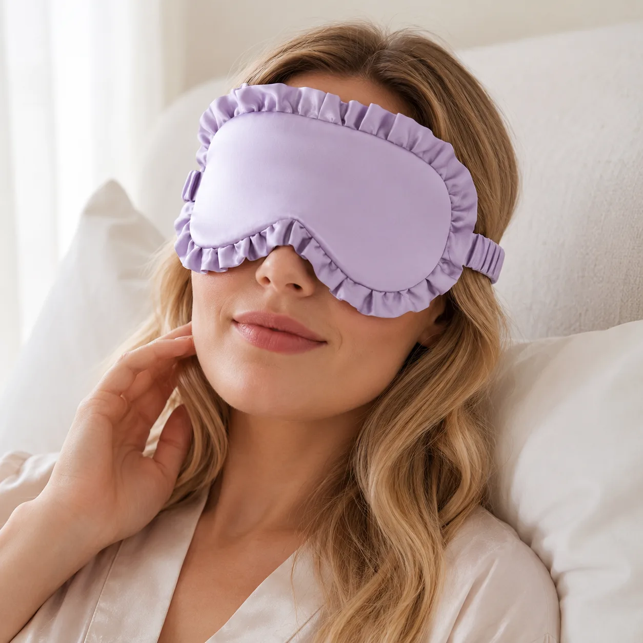 Lavender ruffle silk sleep mask shown in lifestyle use for private label beauty, spa, travel, and gift brand sleep sets