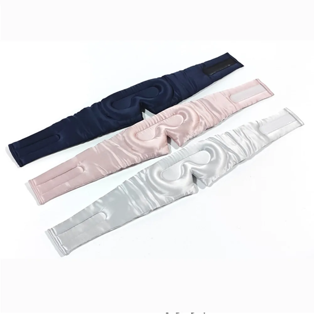 Private label 3D molded silk sleep masks in navy, blush, and silver with adjustable hook-and-loop straps for brand color selection