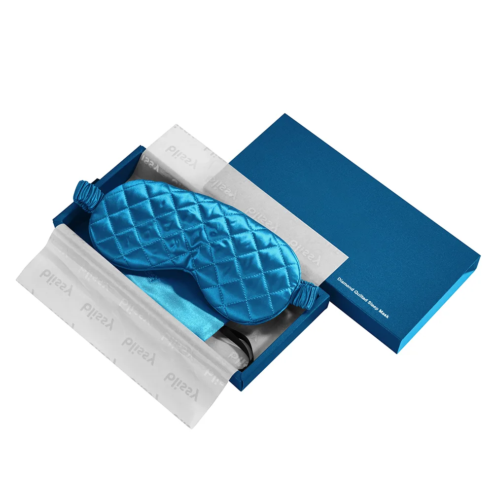 Blue silk sleep mask in branded gift box packaging for private label sleep mask retail and travel kits