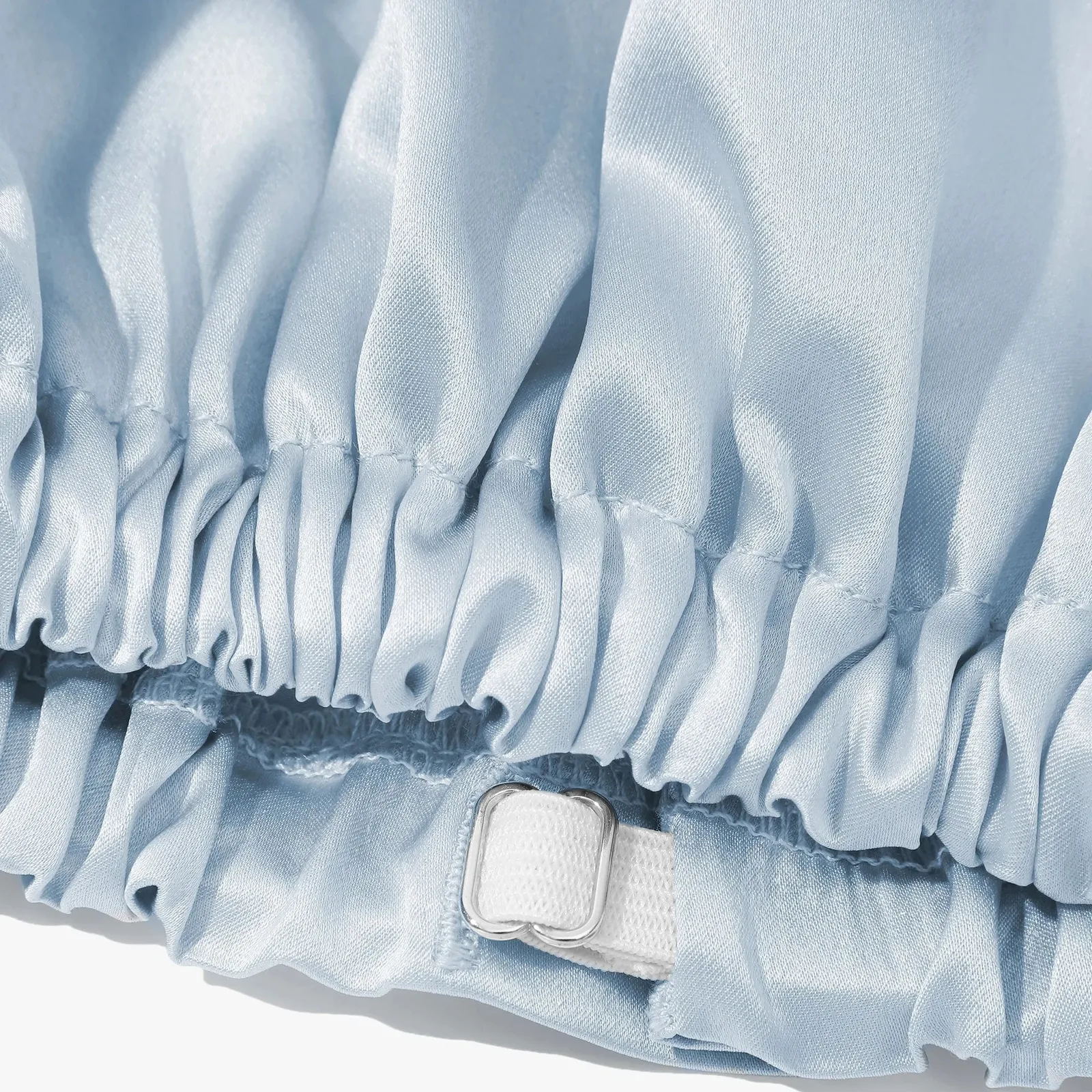 Detail view of light blue private label sleep mask and matching drawstring pouch for custom silk gift set programs