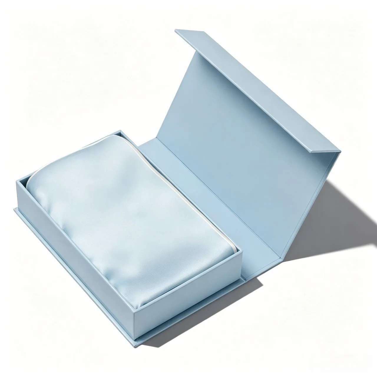 Lifestyle image of a light blue custom silk pillowcase for private label hair care, beauty sleep, and spa retail lines