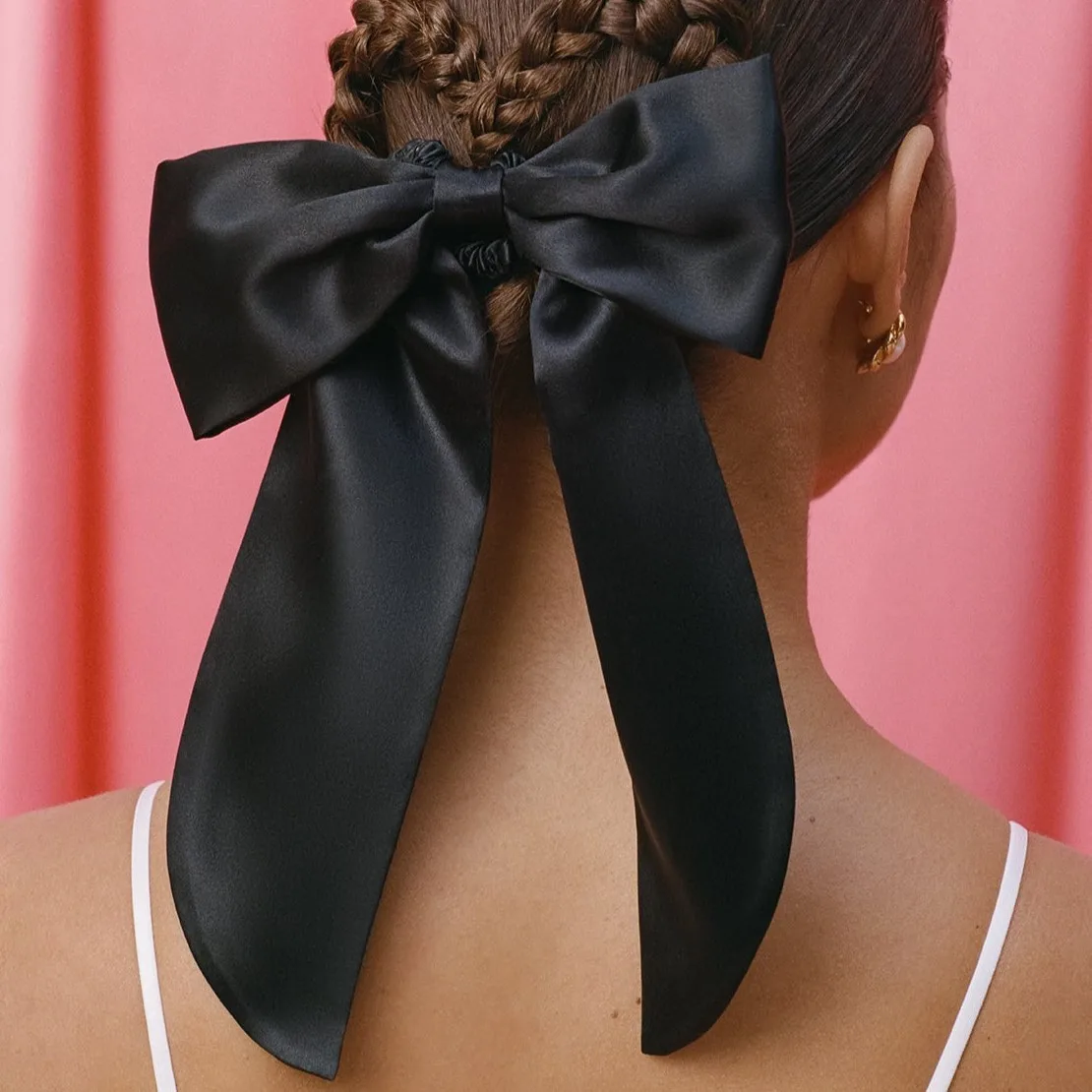 Black custom silk bow scrunchie on braided hairstyle for private label hair accessory and gift set brands