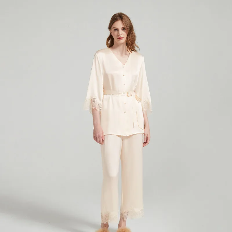 Ivory custom silk pajama style with belted button top, lace-trim sleeves, and wide-leg pants for private label sleepwear collections
