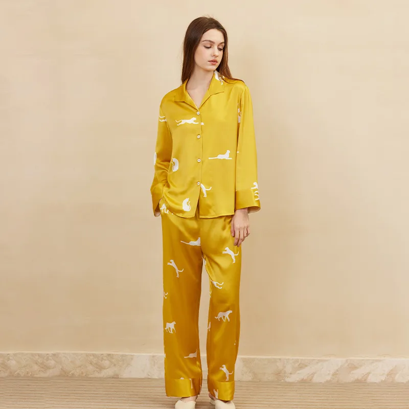 Mustard yellow long sleeve custom silk pajama set with white animal print, shown as a color variant for private label sleepwear branding