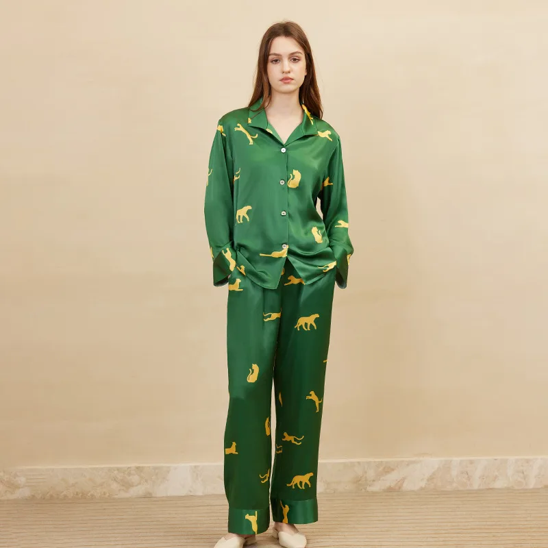 Green animal print custom silk pajama set with button-front top and wide-leg pants for private label sleepwear brands