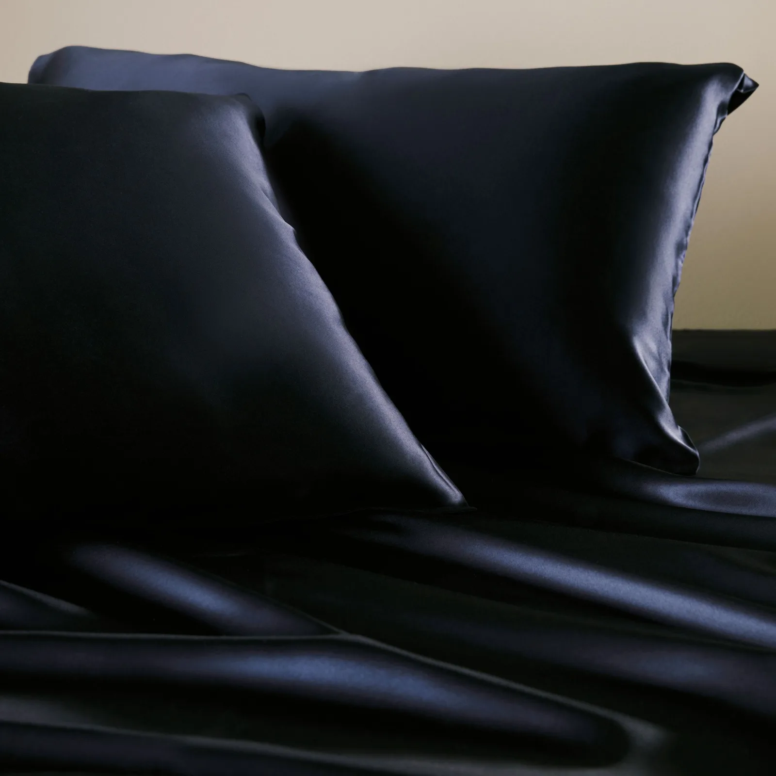Dark satin-finish pillowcase detail for private label bedding or beauty gift set sampling