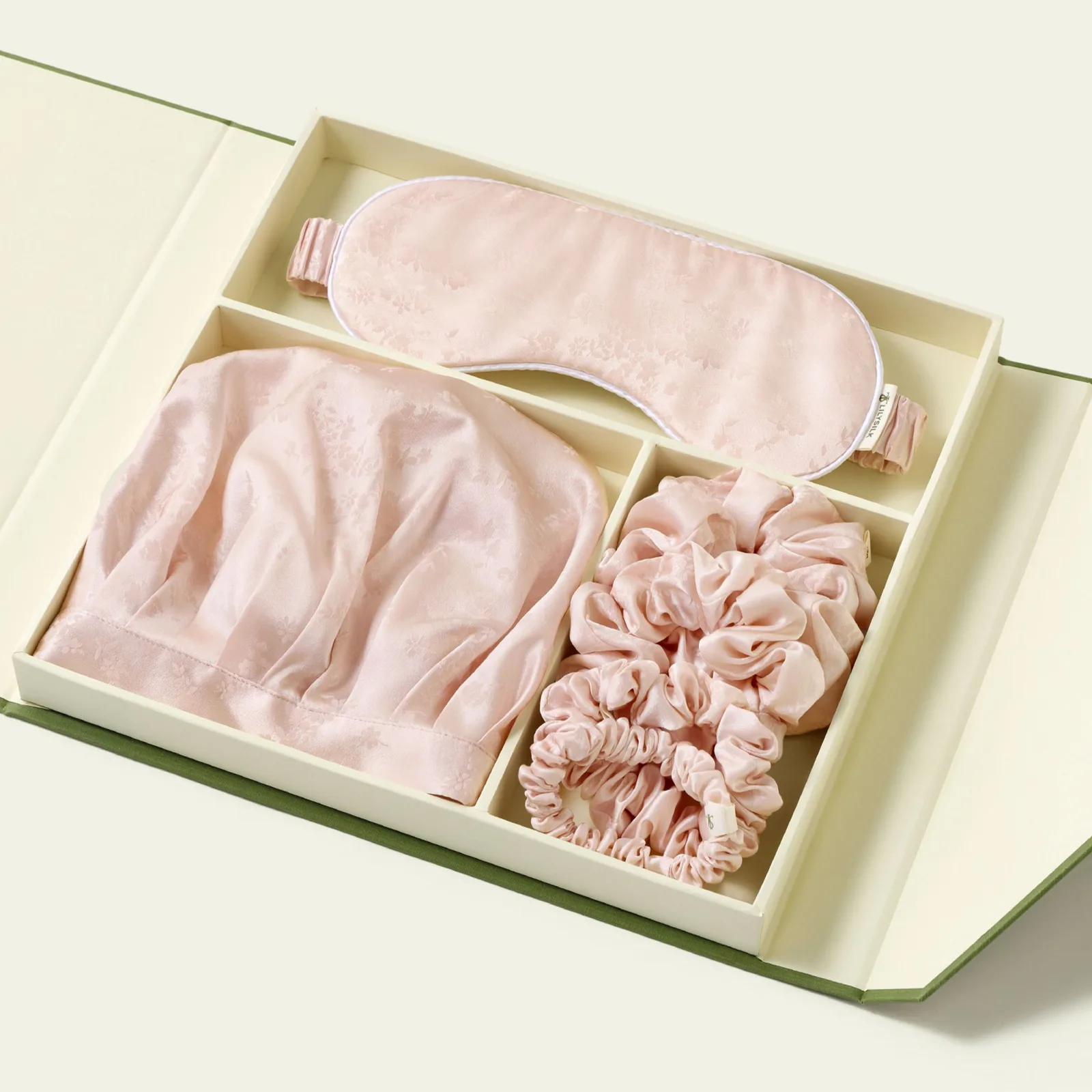 Private label custom silk gift set with pink sleep mask, bonnet, and scrunchies in a compartment box for spa and beauty retail programs