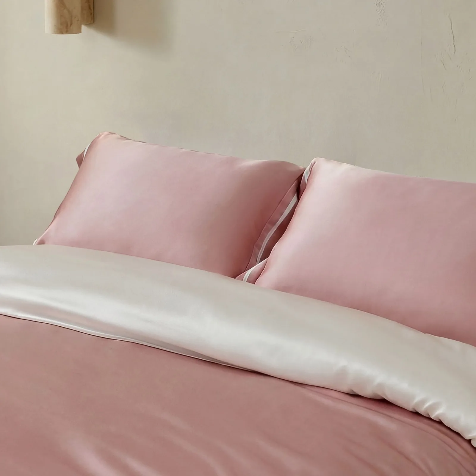 Pink and ivory custom silk bedding detail with pillowcases and duvet cover for private label colorway review