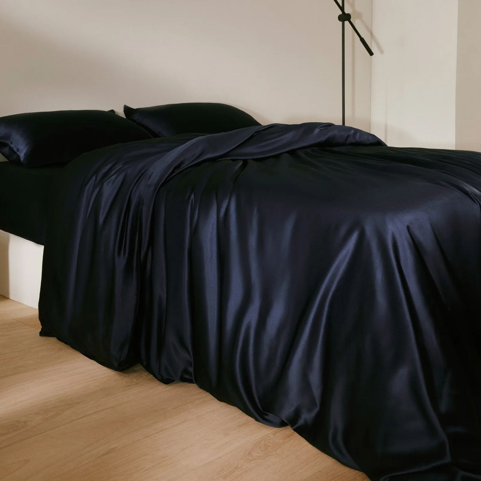Dark custom silk bedding set with duvet cover and pillowcases for private label home and hotel collections