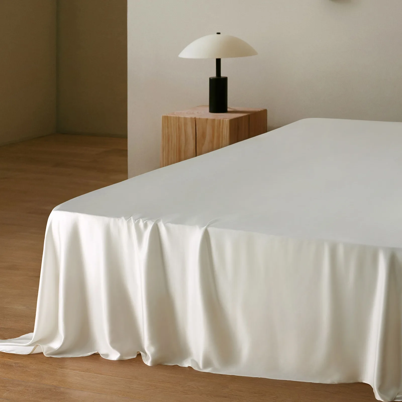 White custom silk bedding style detail with smooth drape for private label sheet and duvet cover programs