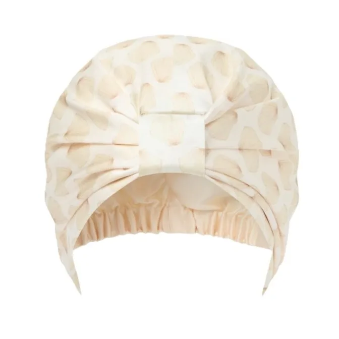 Detail view of silk sleep cap with packaging for private label silk care brands
