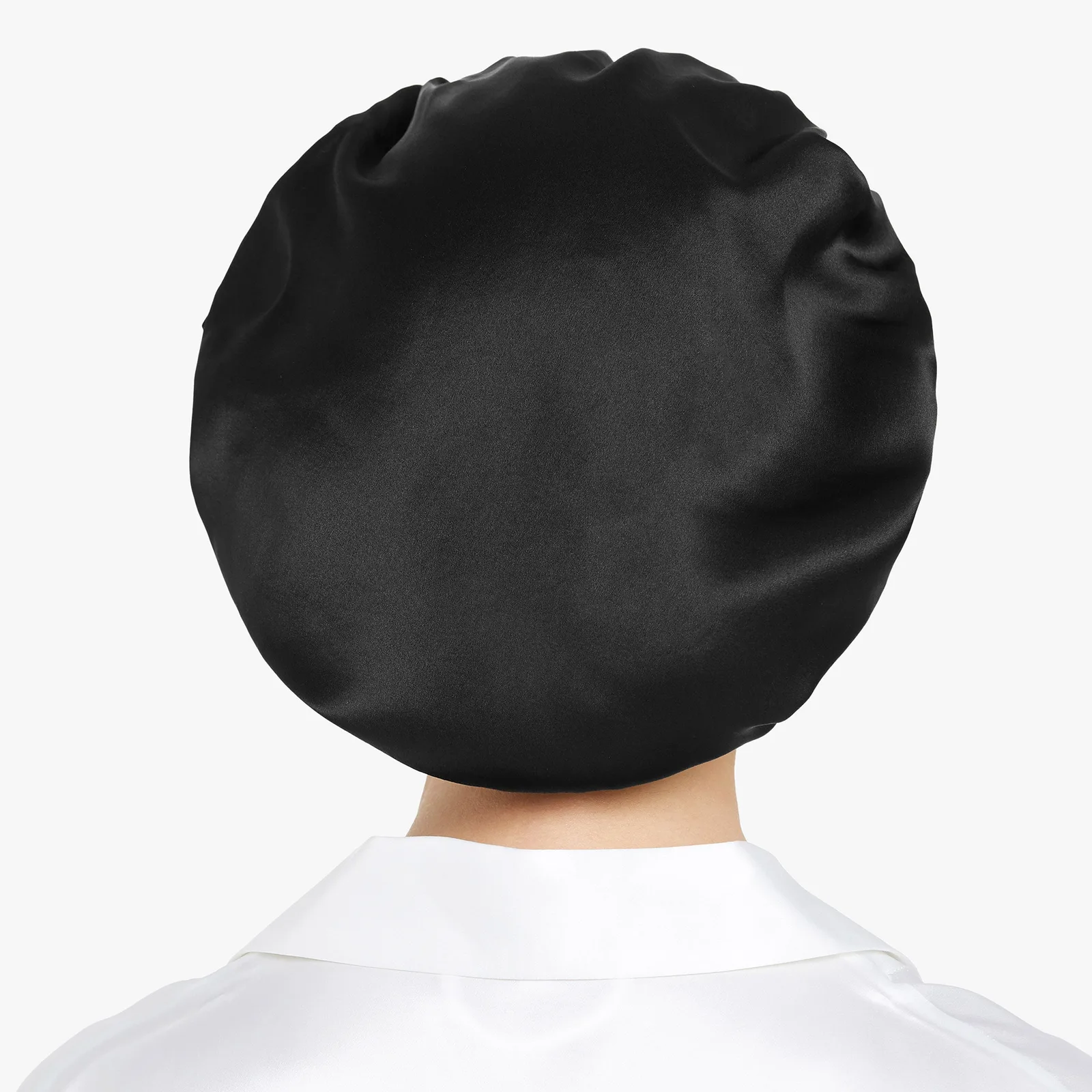 Back detail of black custom silk sleep cap for private label hair care brand review
