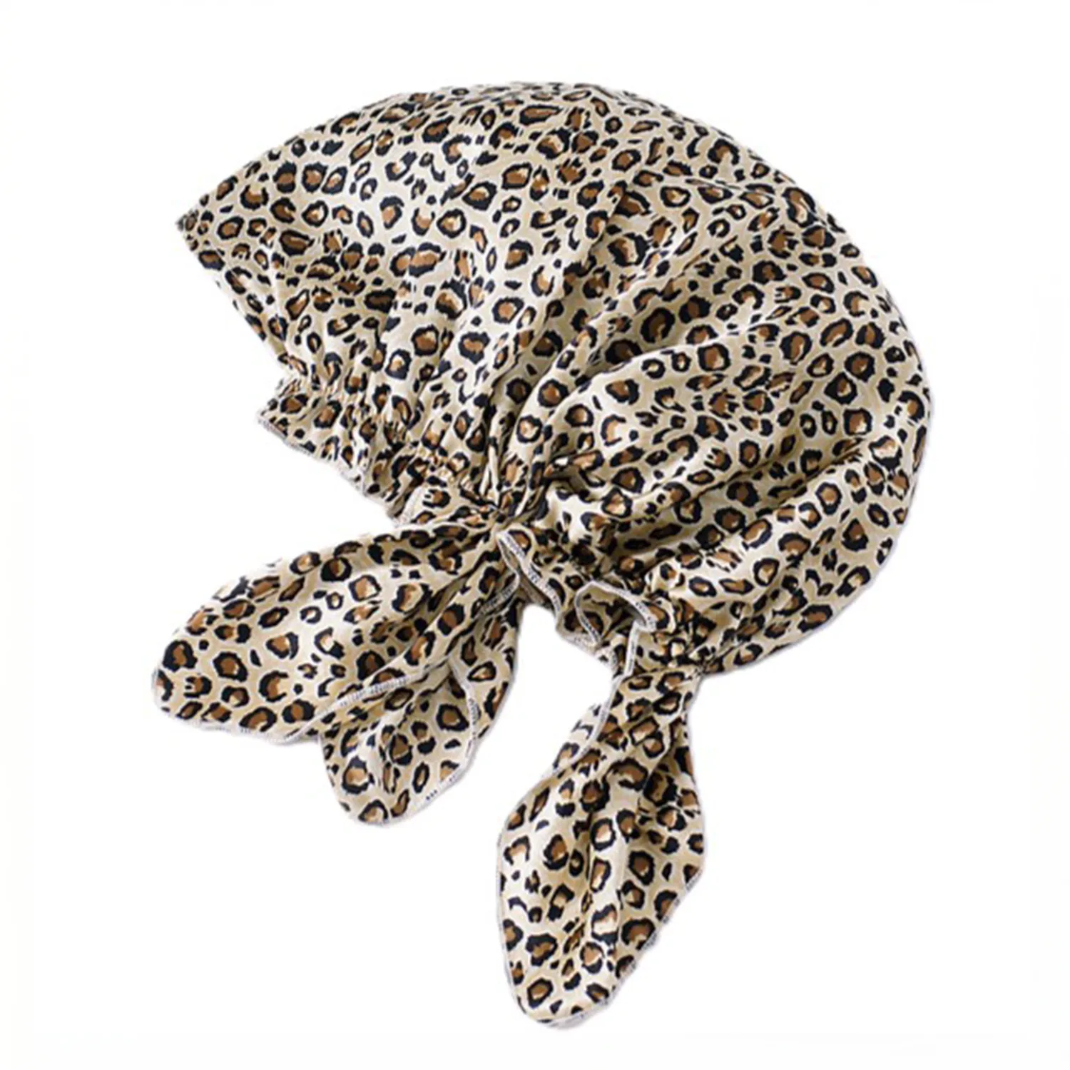 Tie-back silk sleep cap with gathered edge and long ribbon ties shown in blush pink for private label hair care and beauty brand programs