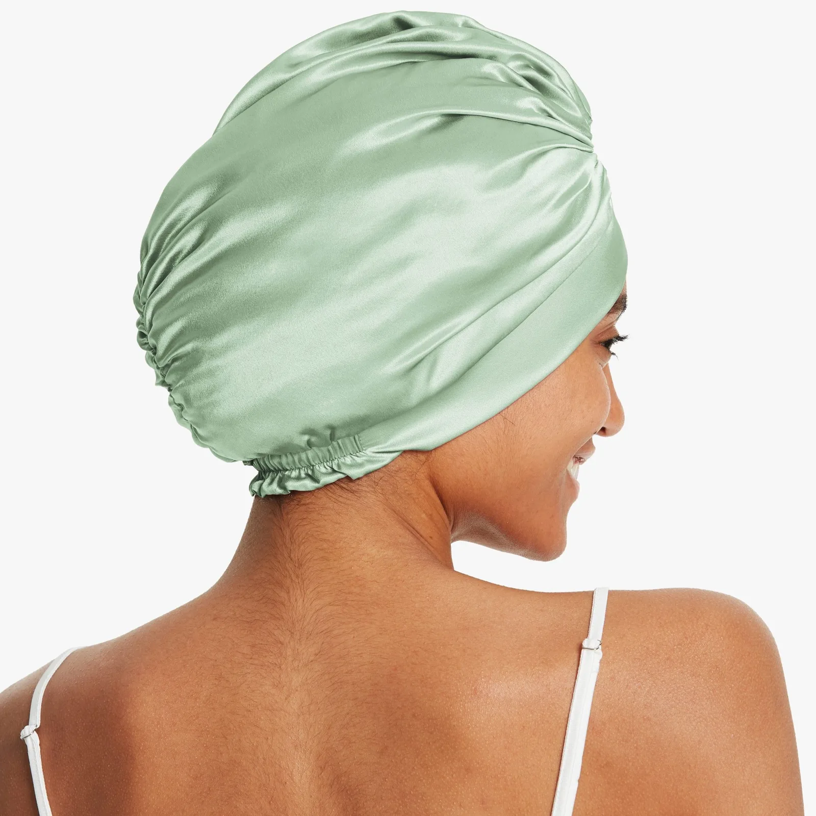 Mint green custom silk sleep cap with elastic back, side detail for private label hair care brands