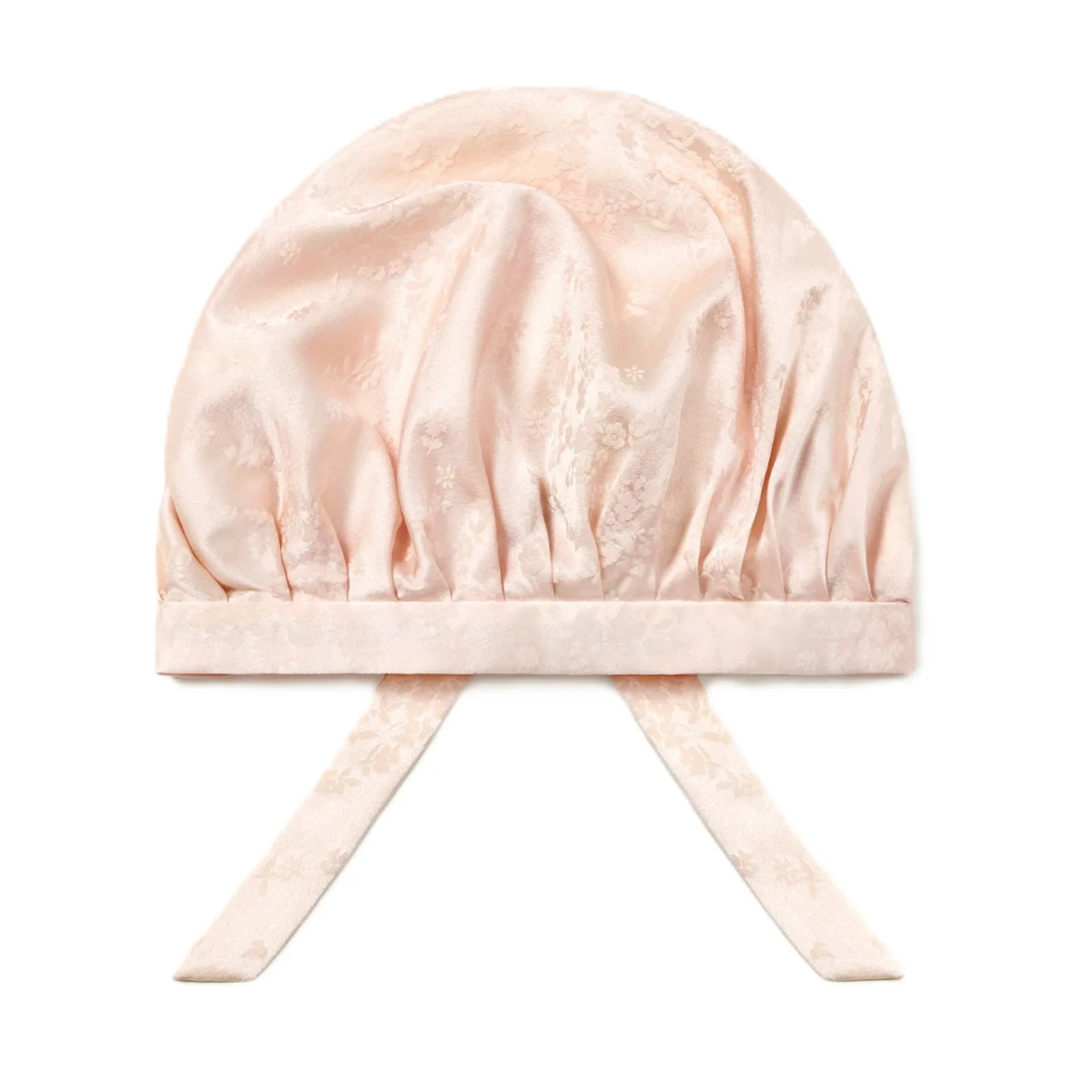 Blush pink stretch jacquard silk sleep cap with adjustable back-tie closure and gathered bonnet crown for private label hair care brands
