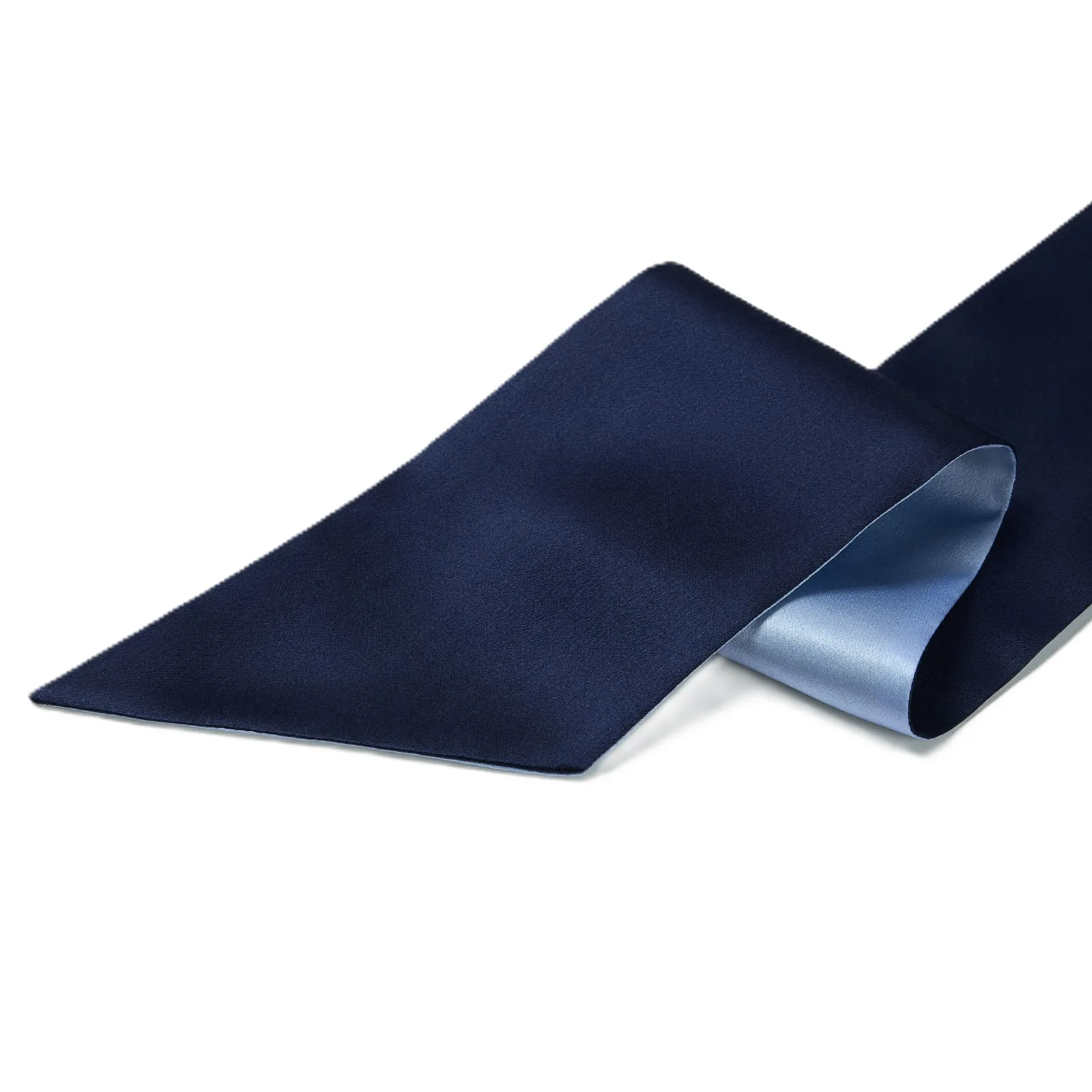 Detail view of navy and light blue fabric panels for a custom silk sleep cap style for private label hair care brands