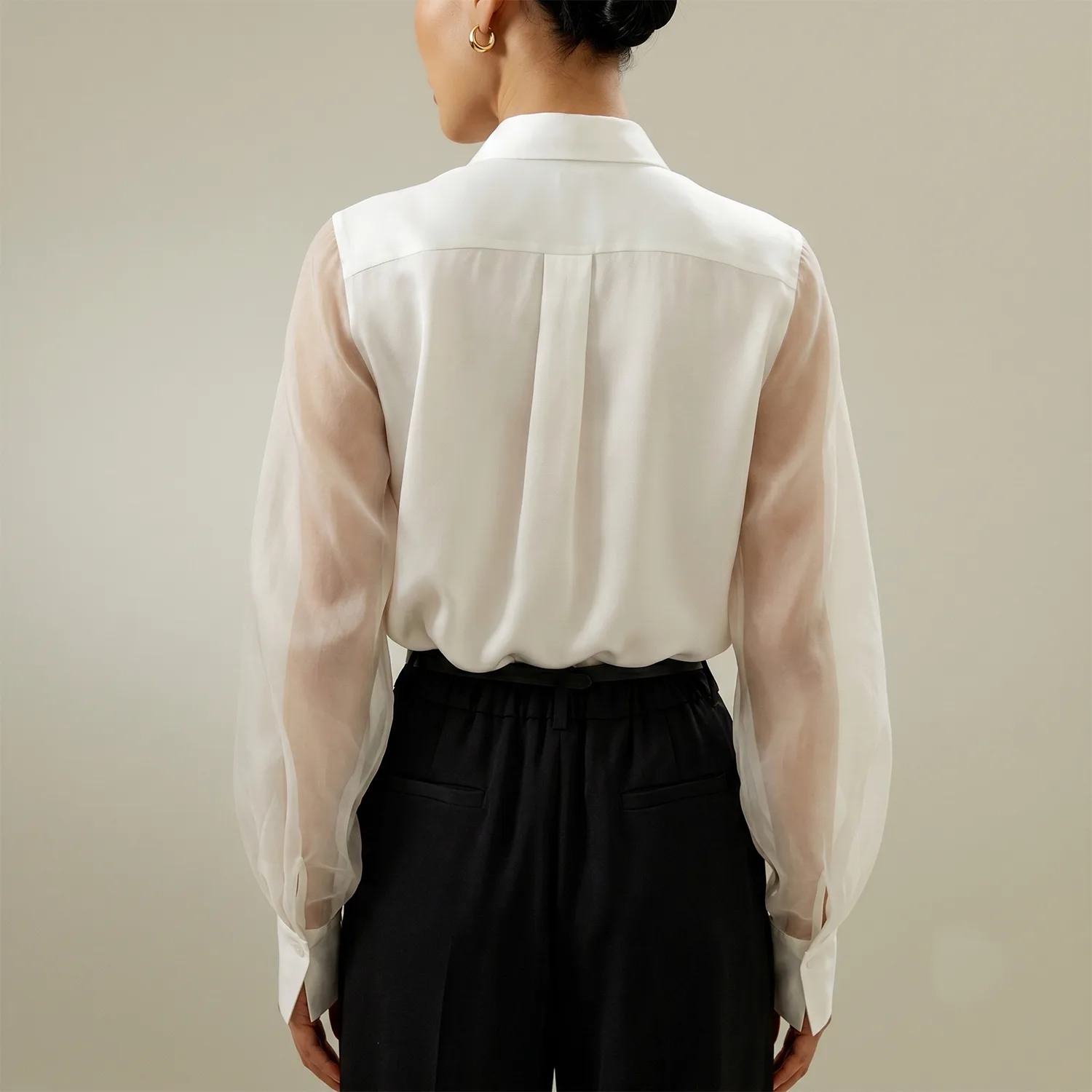 Back view of white long sleeve blouse with sheer sleeves and pleated yoke for private label silk clothing style review