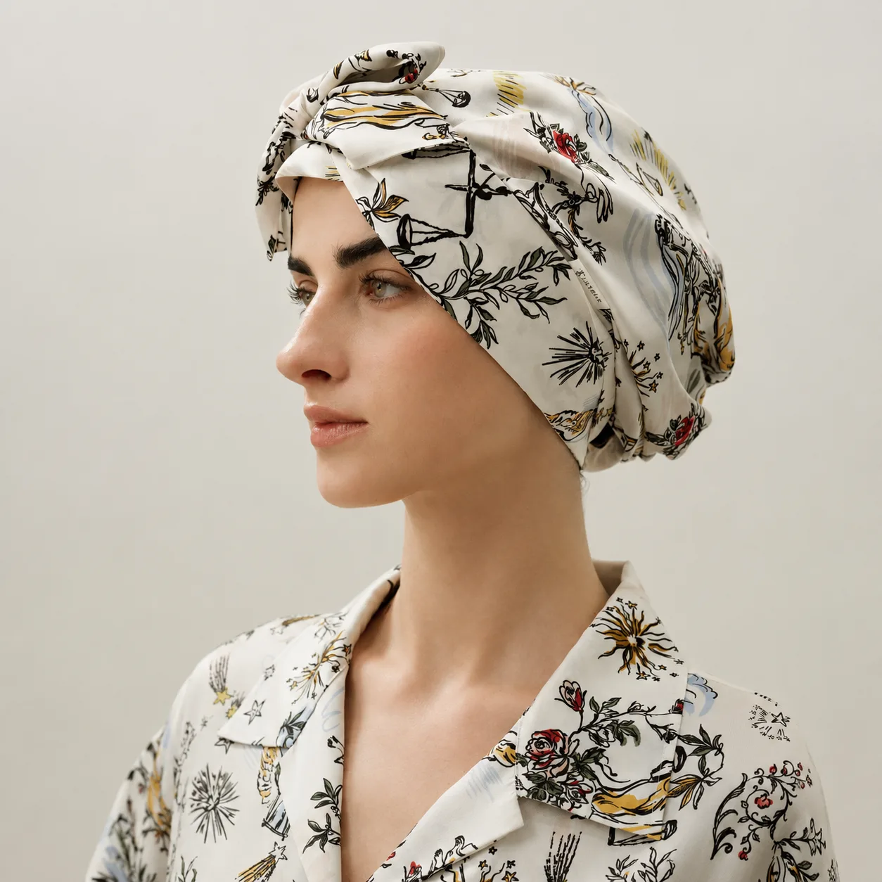 Printed custom silk sleep cap with front bow detail for private label hair care and beauty brand collections