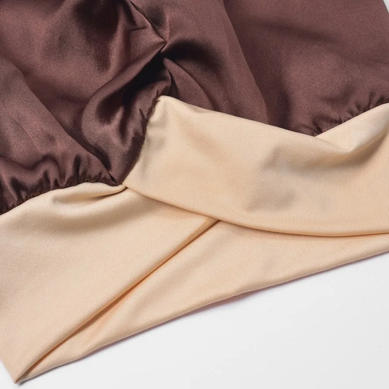 Detail view of custom silk sleep cap with contrast wide band for private label hair care and beauty brands