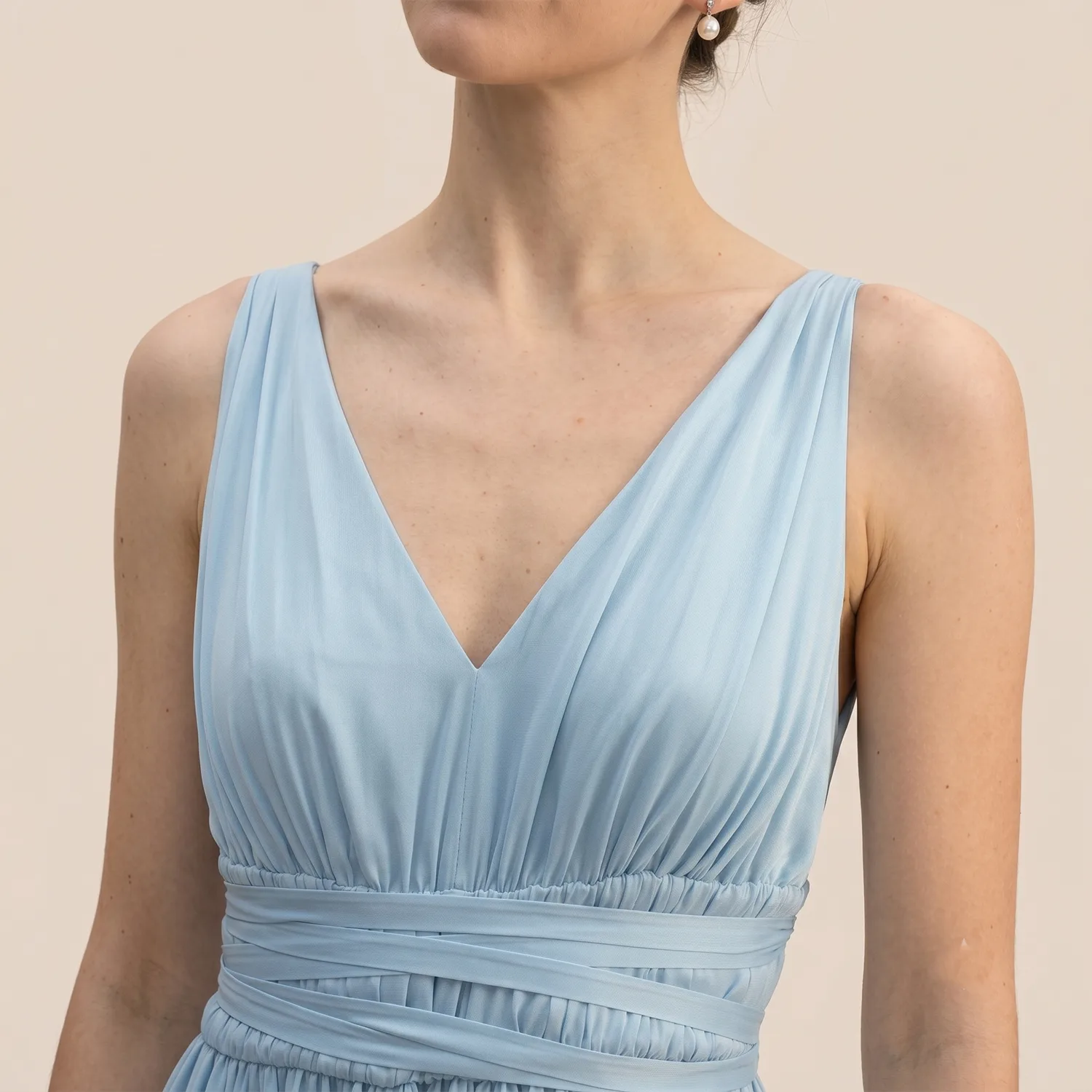 Detail view of light blue V-neck sleeveless dress style for custom private label silk clothing development