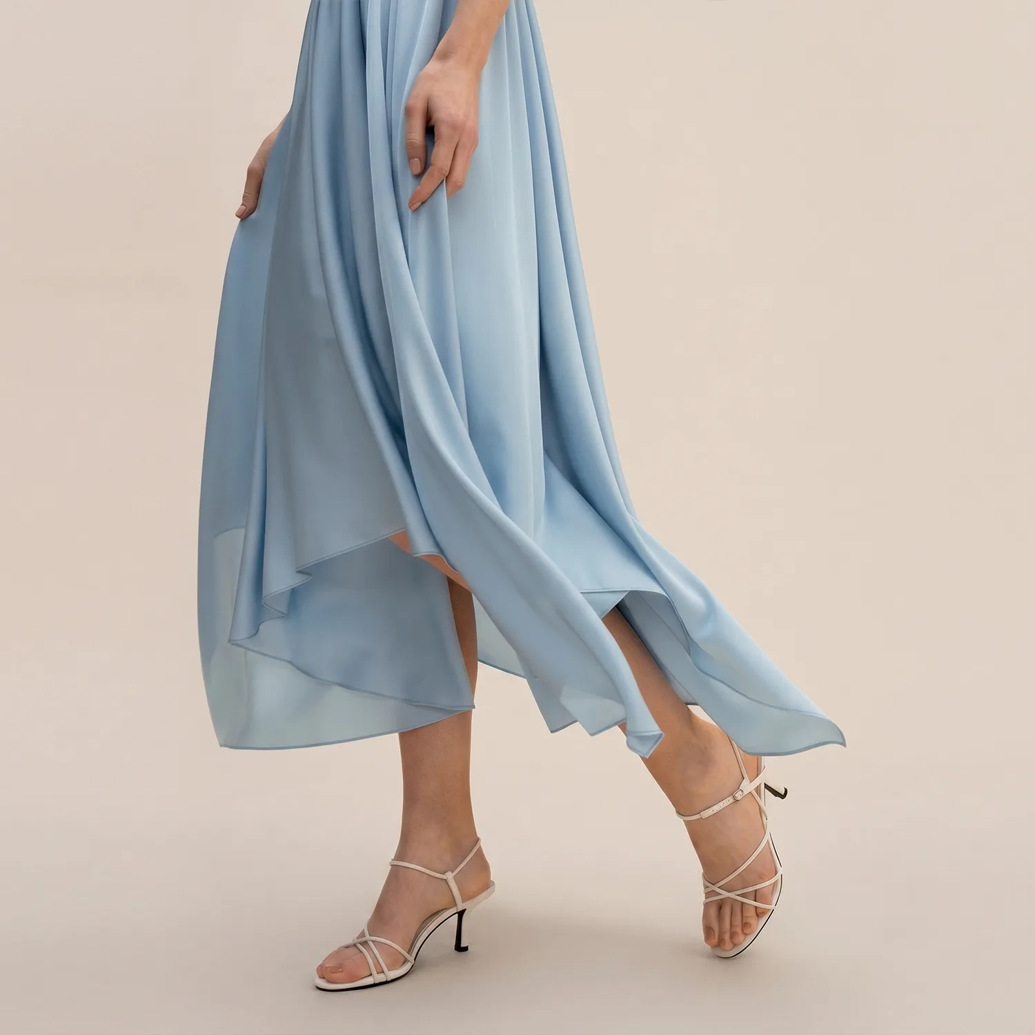 Light blue sleeveless V-neck dress with gathered waist for custom silk clothing private label apparel review