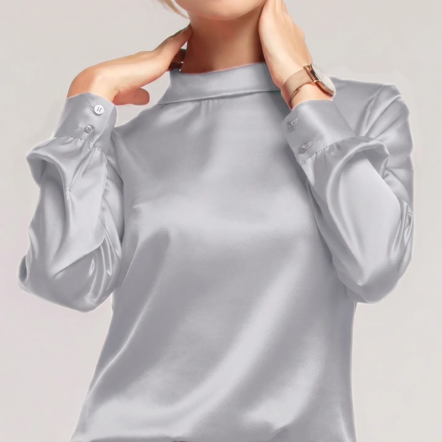 Detail view of silver high-neck long-sleeve silk blouse for custom private label apparel development