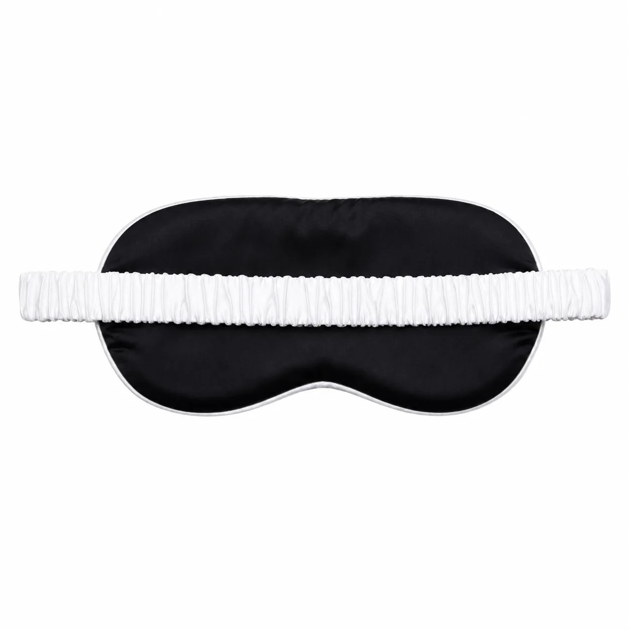 Black-and-white sleep mask detail with elastic strap for custom private label silk gift set programs