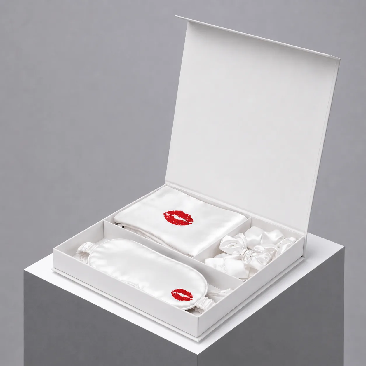 Open white private label gift box with sleep mask, pouch and scrunchies for custom silk gift set presentation