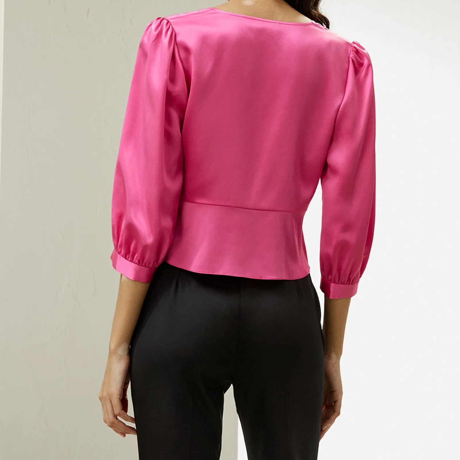 Back detail of pink custom silk clothing style with puff sleeves for private label apparel brands