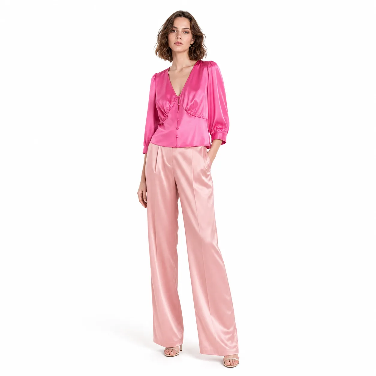 Private label silk charmeuse blouse in fuchsia with puff sleeves, fabric-covered buttons, and empire seam for custom apparel brand programs