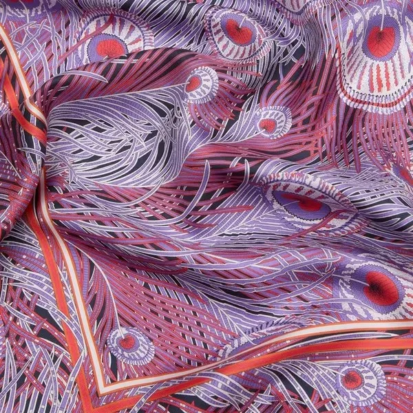 Detail view of a custom printed scarf with purple and red feather motif for private label gift-ready scarf sets