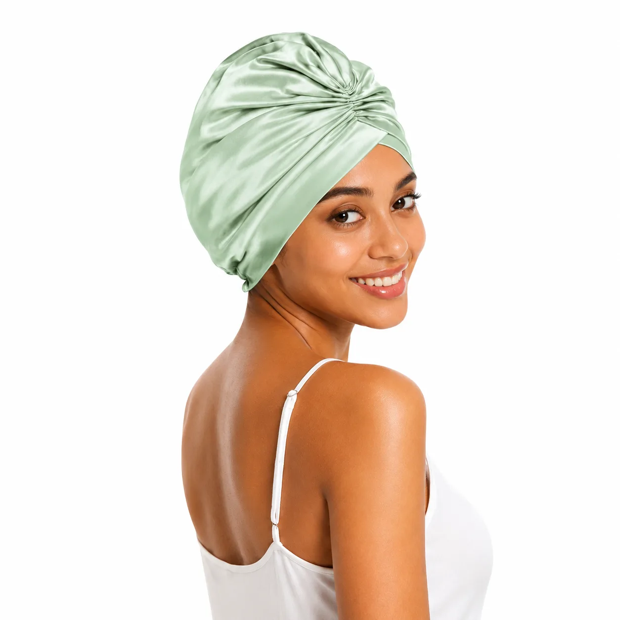 Mint green custom silk sleep cap with gathered turban front on model for private label hair care and beauty brands