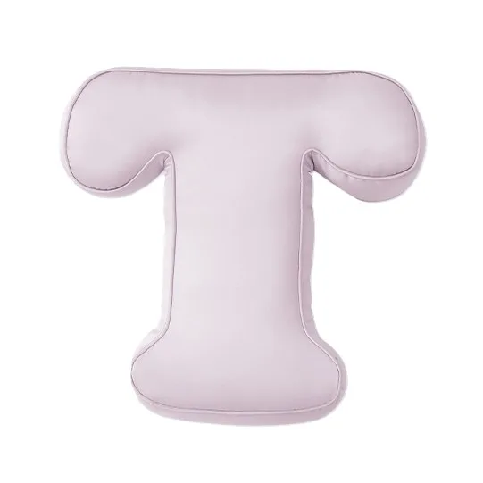 Detail view of T-shaped padded kids alphabet cushion with rounded corners and piped edge seams for private label construction review