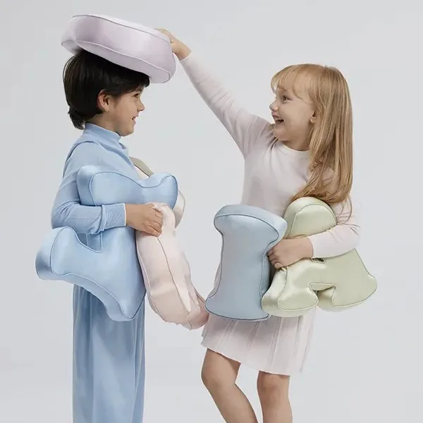 Letter-shaped padded kids cushion with rounded edge seams and soft filled construction for private label comfort product development