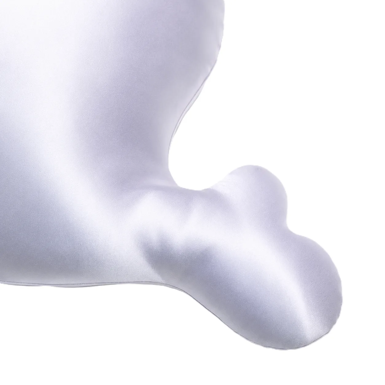 Detail of whale-shaped kids silk decorative pillow showing padded tail structure and clean curved edge seam for private label kids product lines