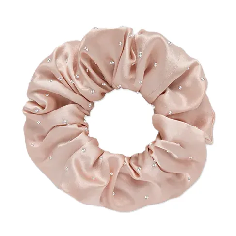 Oversized silk scrunchie detail showing gathered tubular construction and enclosed elastic band for a comfortable private label hair accessory fit