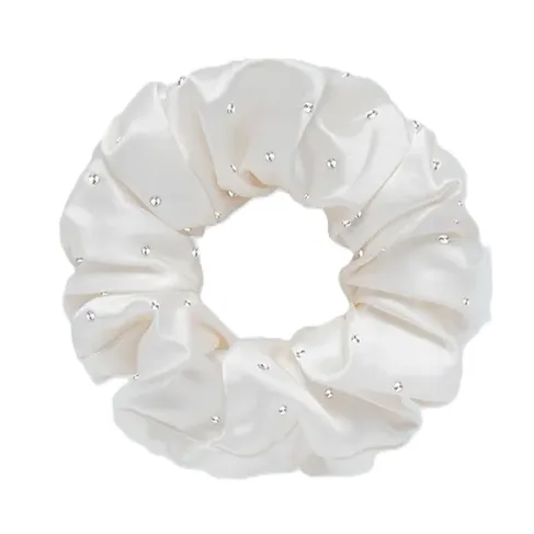 Detail view of an oversized silk scrunchie with gathered tube construction and covered elastic band for comfortable private label hair accessory fit