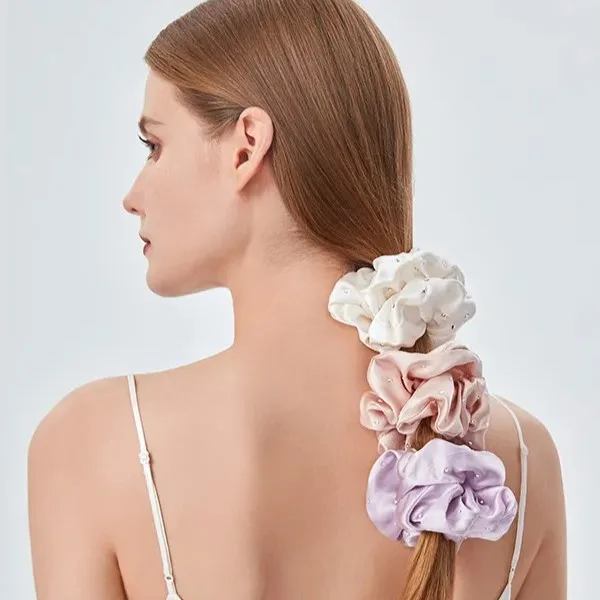 Oversized rhinestone silk scrunchies styled for private label retail hair accessory and gift set programs