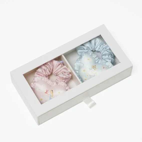 Window gift box packaging for a private label illustrated silk hair set, suited for retail display, spa gifting, and brand presentation