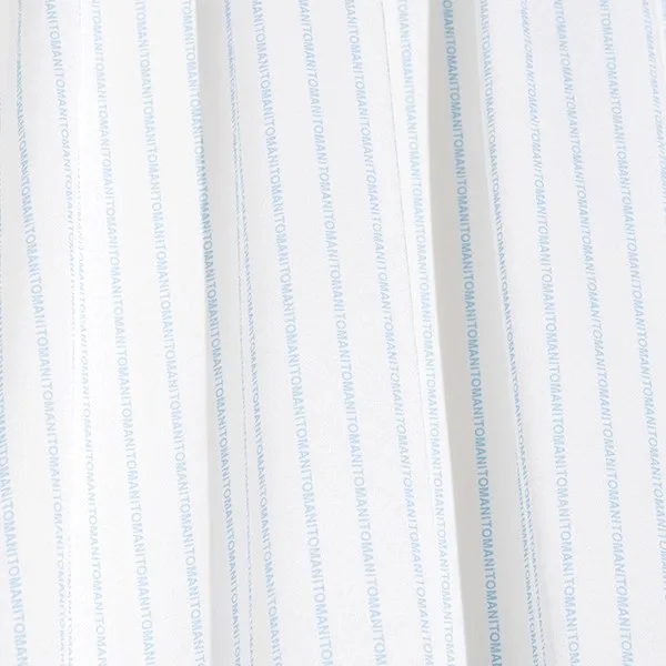 Close-up of private label kids garment construction with vertical pleated panels and fine seam lines for soft drape and comfortable fit