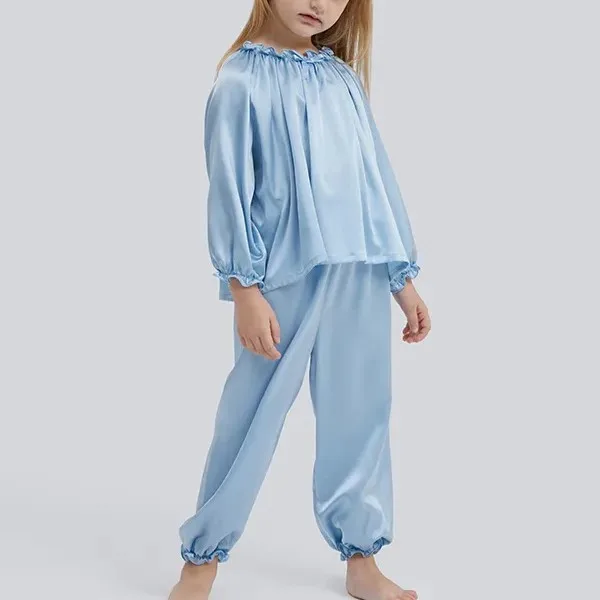Loose-fit kids pajama set with gathered neckline, elastic sleeve cuffs, and banded pant hems for private label comfort review