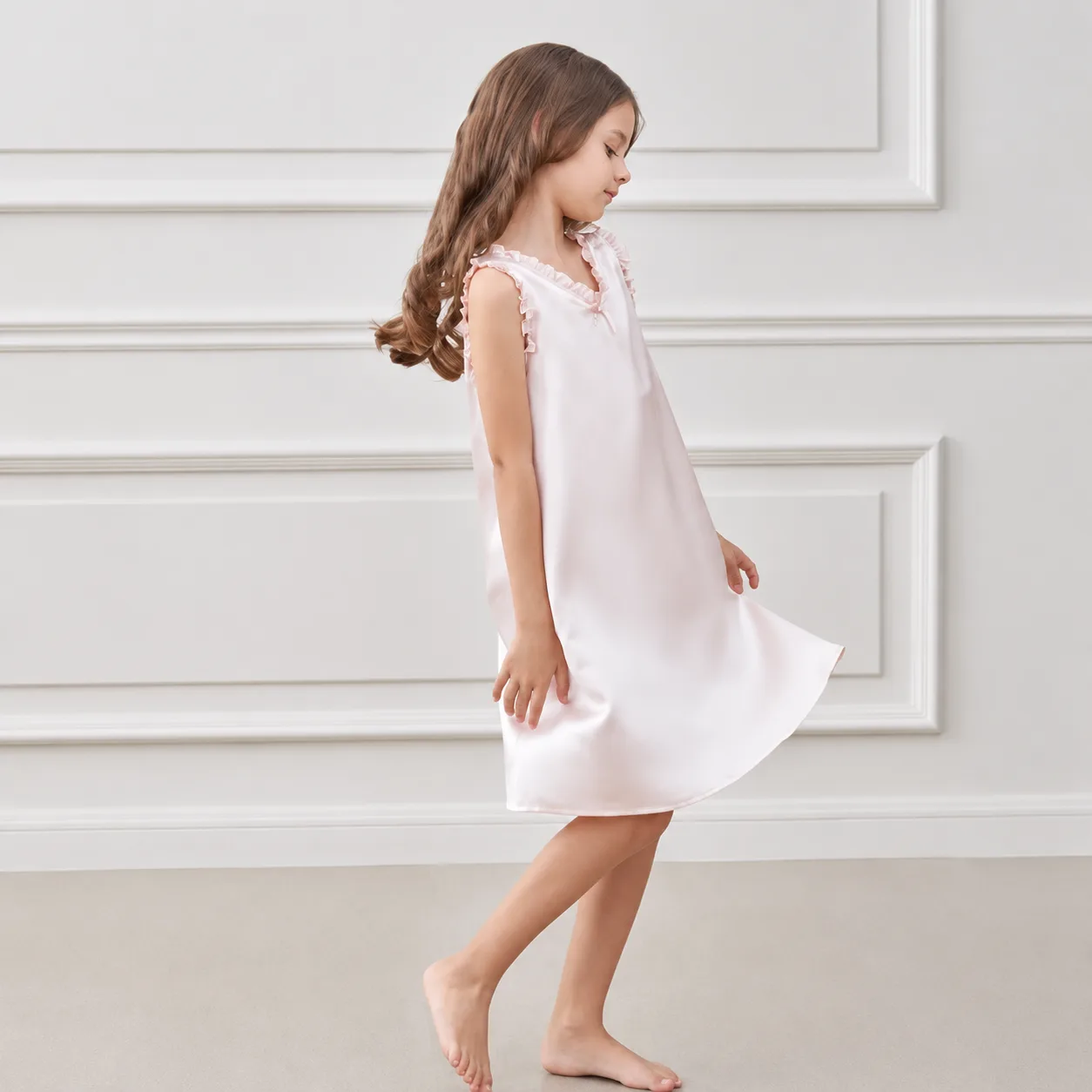 Kids private label sleep dress with loose A-line shape, ruffled shoulder straps, finished neckline, and smooth hem for comfortable movement