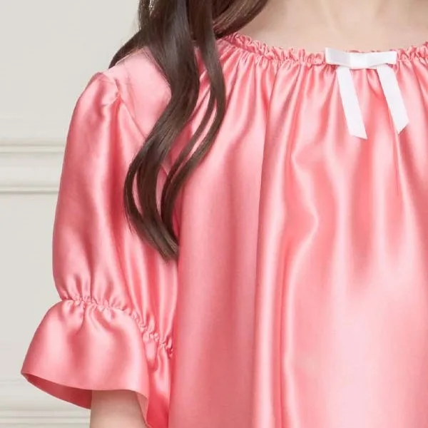 Detail view of custom kids nightgown with gathered neckline and elastic ruffle sleeve cuffs for a relaxed private label fit