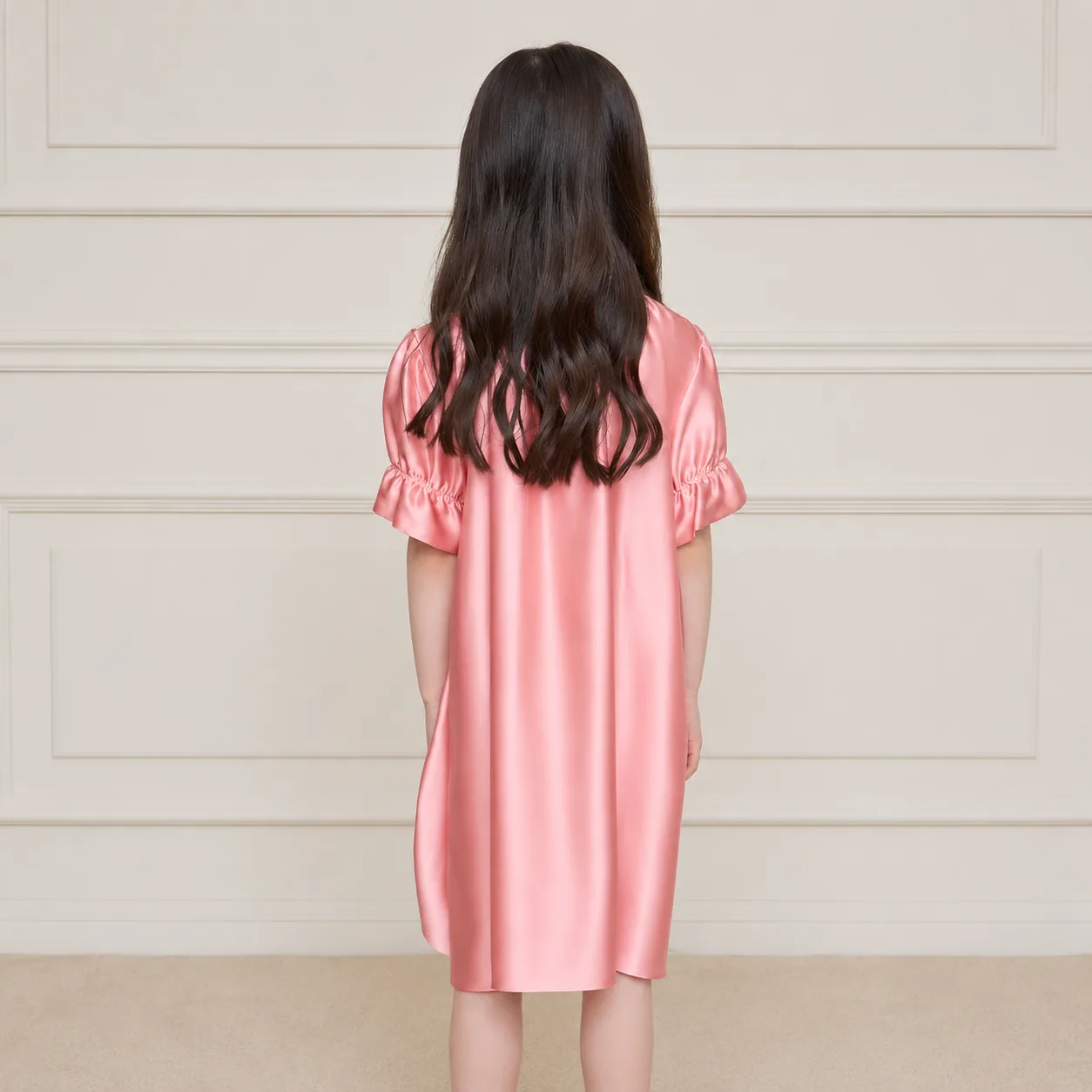 Back detail of custom kids silk sleepwear with relaxed straight fit, short elastic ruffle sleeves, soft seams, and easy knee-length drape for private