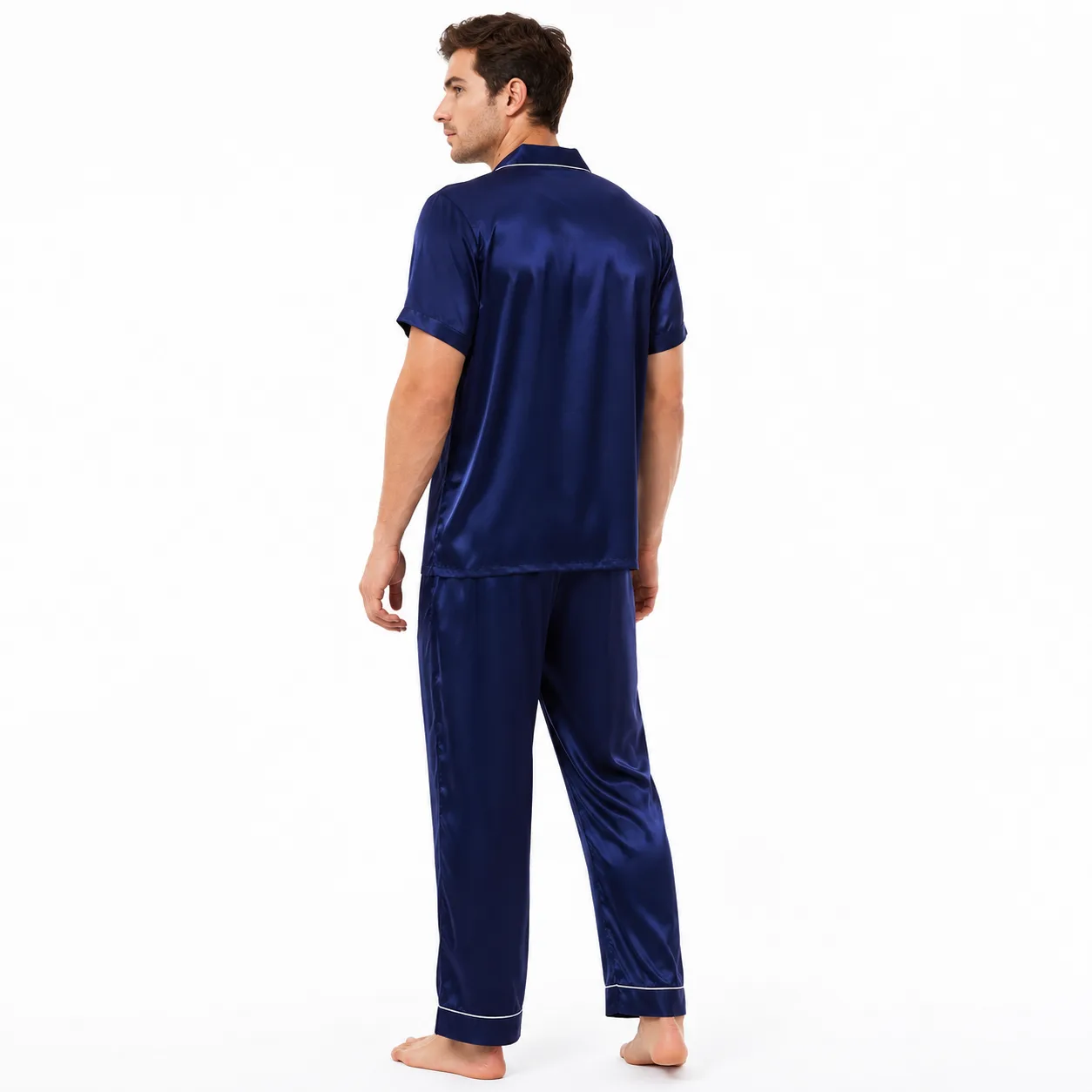 Back detail of custom silk pajama set with short-sleeve camp-collar top, relaxed straight-leg pants, piped hems, and loose sleepwear fit