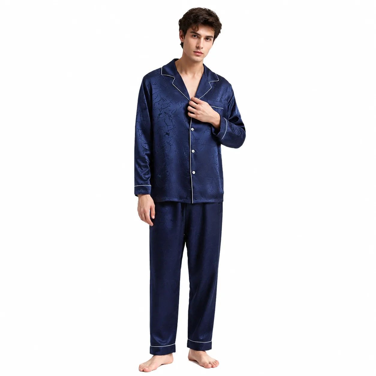 Men's private label pajama set with relaxed button-front top, notched collar, piped edges, long sleeves, and straight-leg pants for comfortable