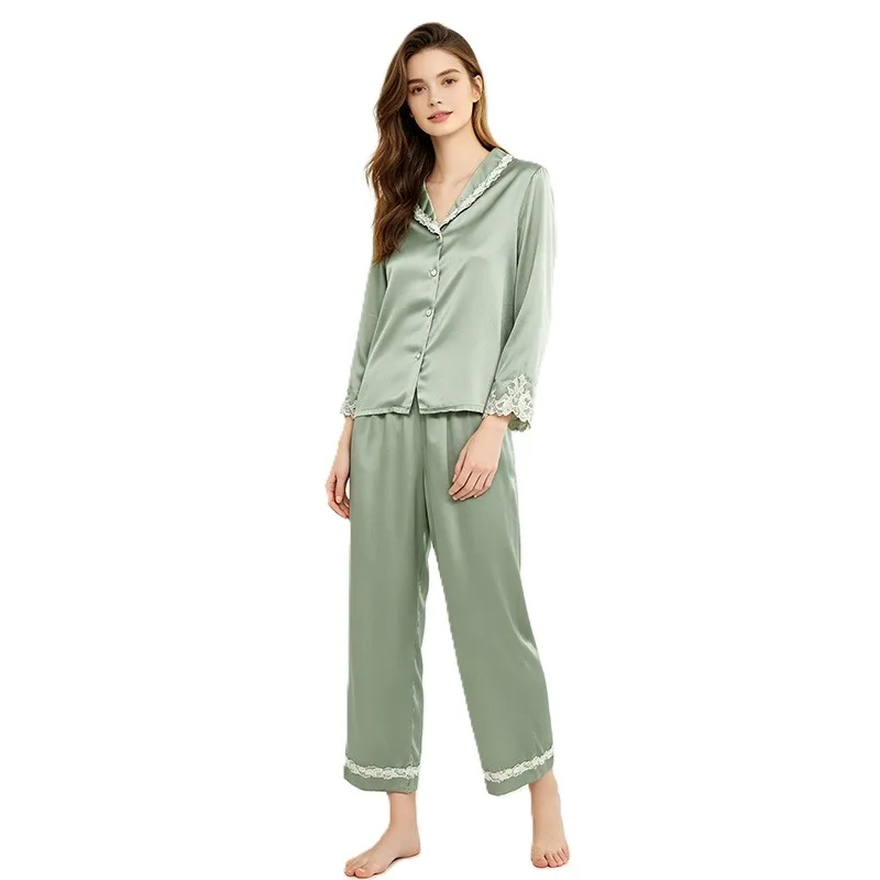 Two-piece custom silk pajama style with button-front top, notched collar, relaxed cropped pants, and lace-trim edge finish for private label sleepwear