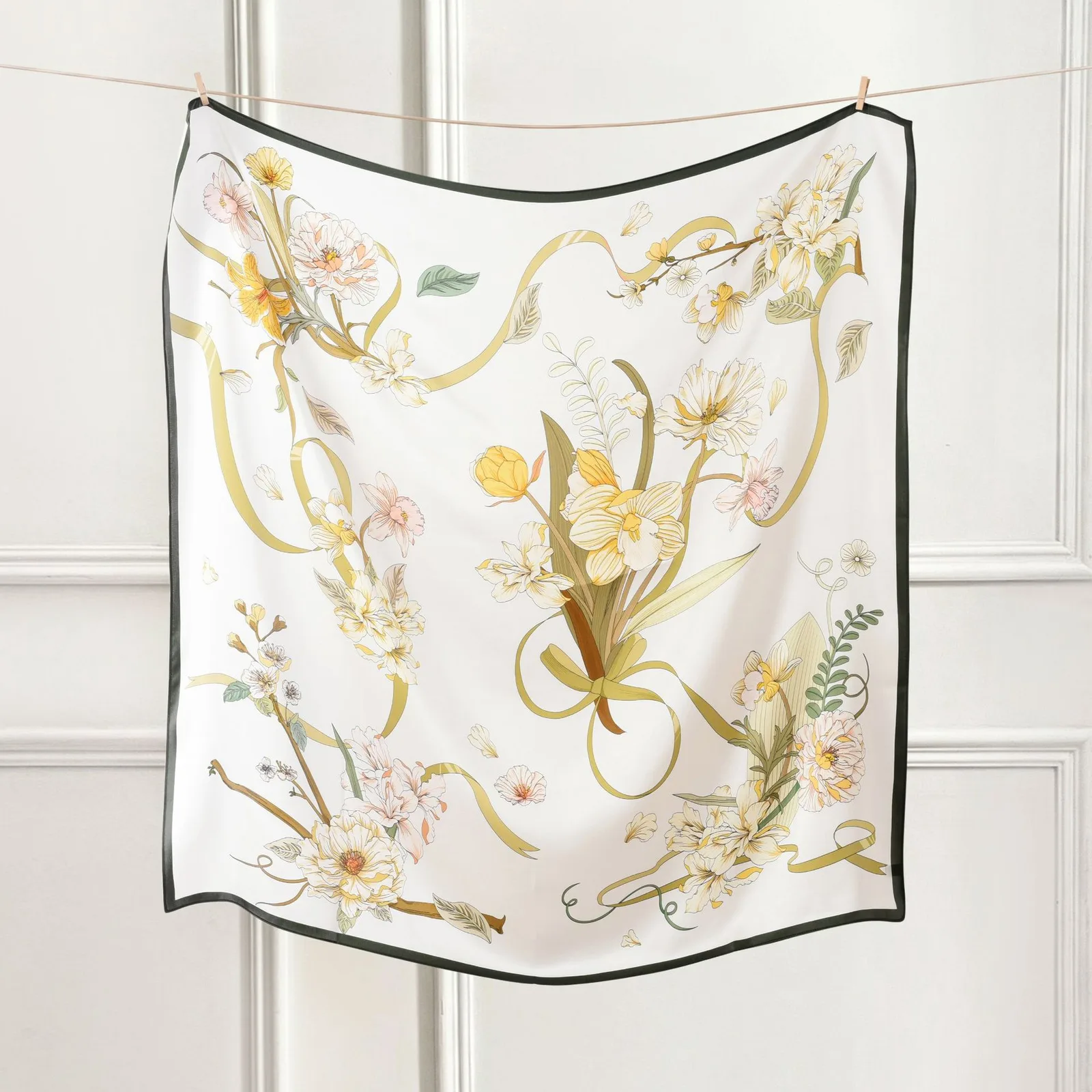 Detail view of a custom silk scarf featuring floral designs, showcasing its high-quality construction and refined edges, ideal for private label and